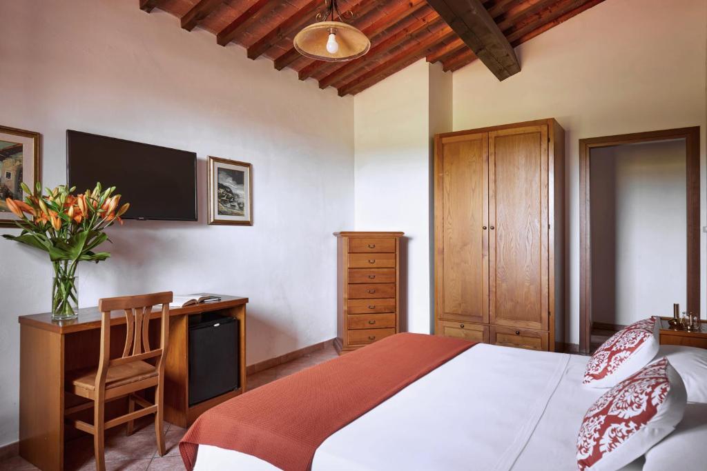 Postel nebo postele na pokoji v ubytování Hotel Fattoria Belvedere