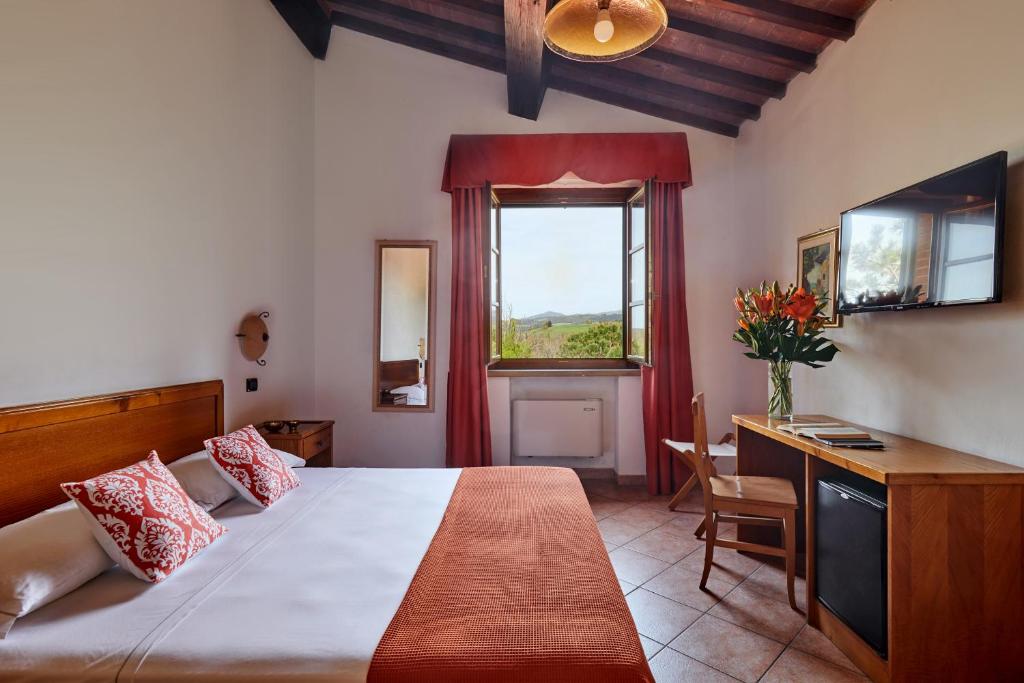 Postel nebo postele na pokoji v ubytování Hotel Fattoria Belvedere