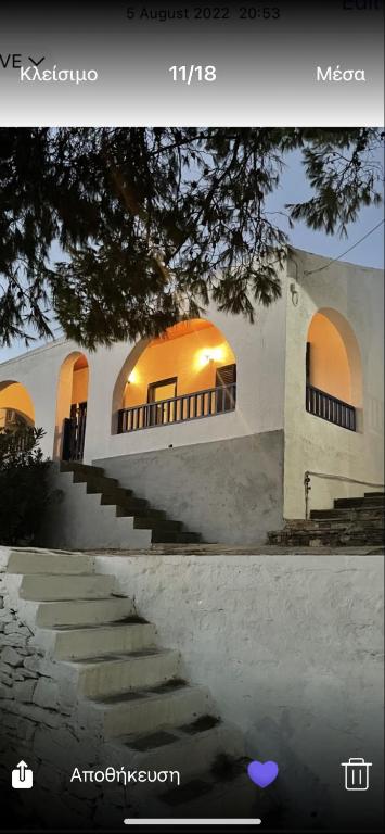 a picture of a building with a staircase in front at Kanala house in Kithnos