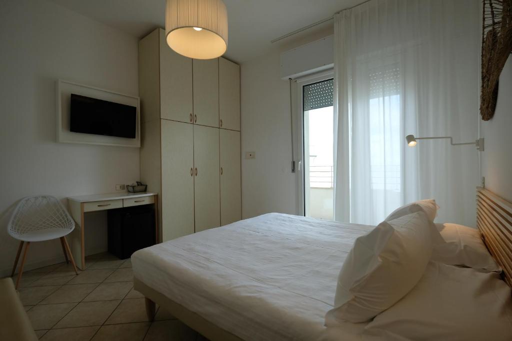 Postel nebo postele na pokoji v ubytování Hotel Solemare