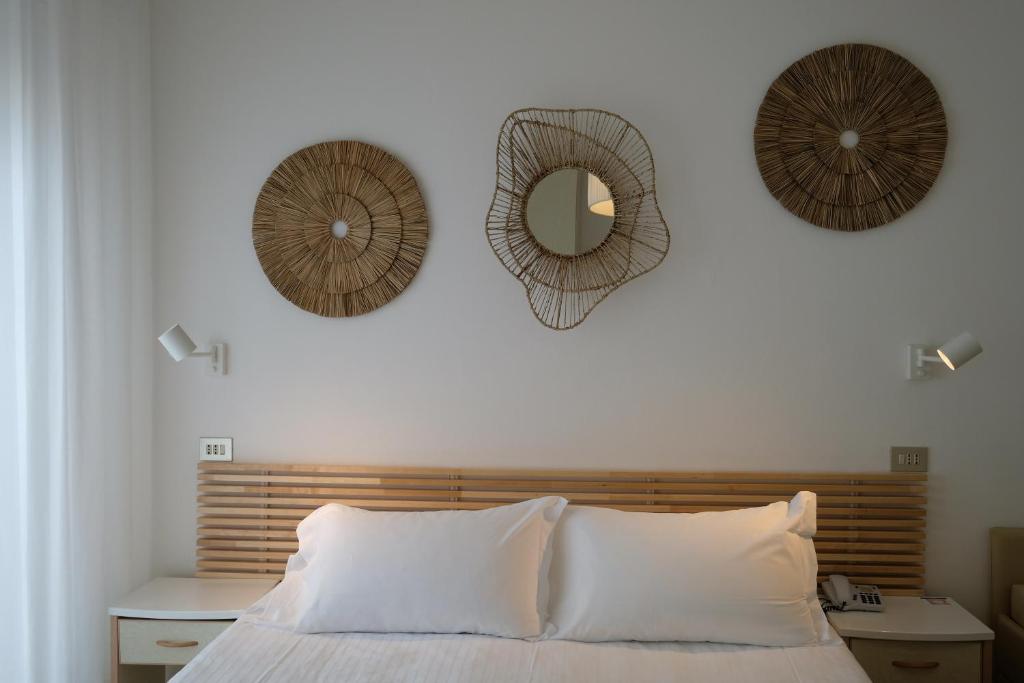 Postel nebo postele na pokoji v ubytování Hotel Solemare
