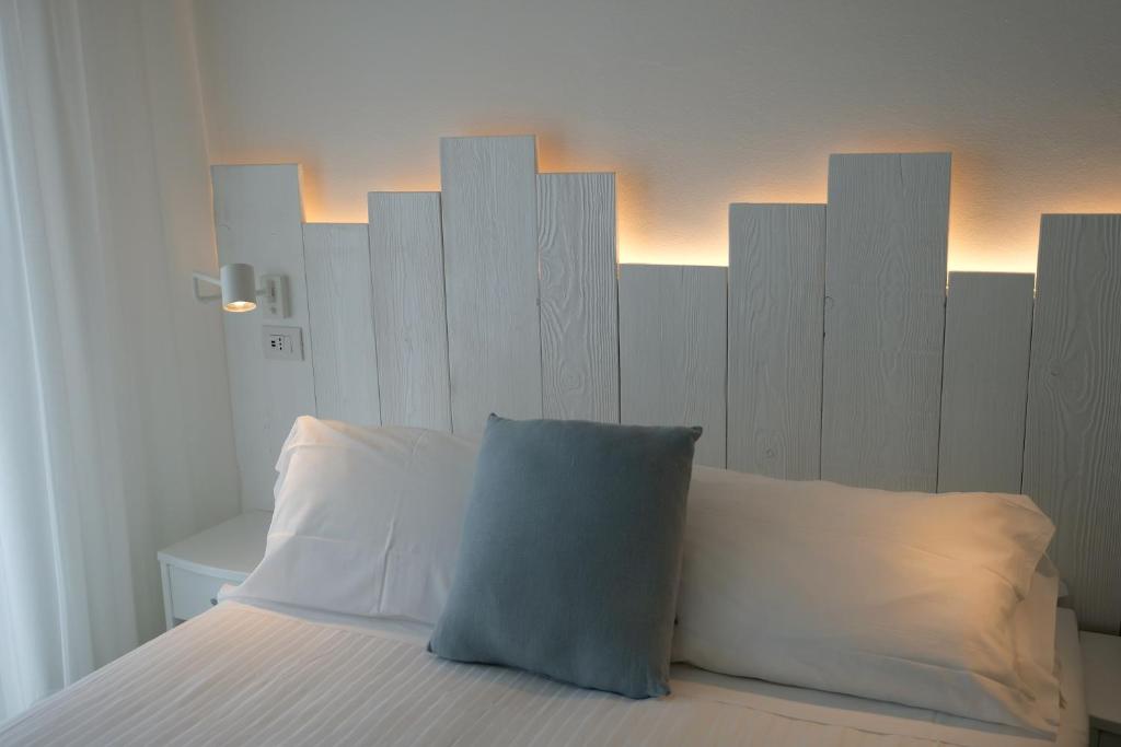 Postel nebo postele na pokoji v ubytování Hotel Solemare