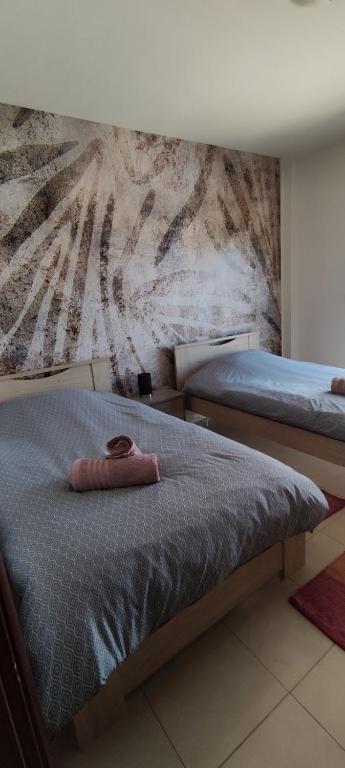 Posteľ alebo postele v izbe v ubytovaní MariZot Apartment