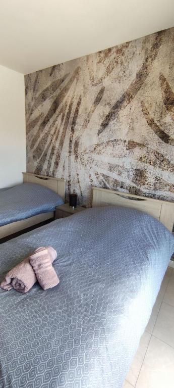 Posteľ alebo postele v izbe v ubytovaní MariZot Apartment