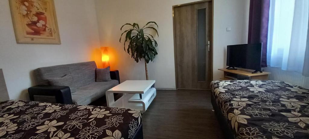 Postel nebo postele na pokoji v ubytování Apartmány u náměstí Sušice