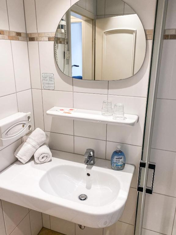 Koupelna v ubytování Hotel Garni Silvana