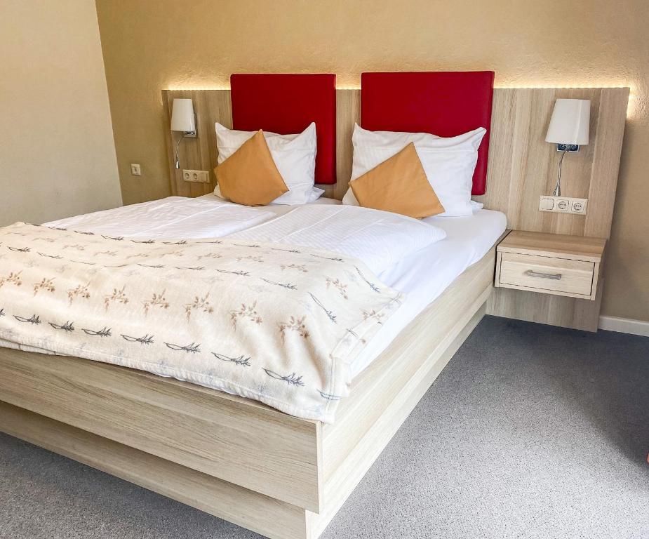 Postel nebo postele na pokoji v ubytování Hotel Garni Silvana