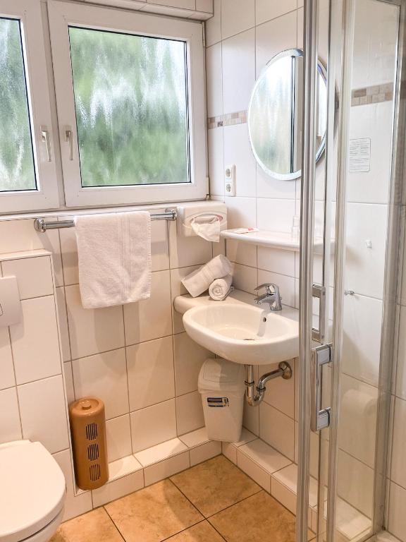 Koupelna v ubytování Hotel Garni Silvana