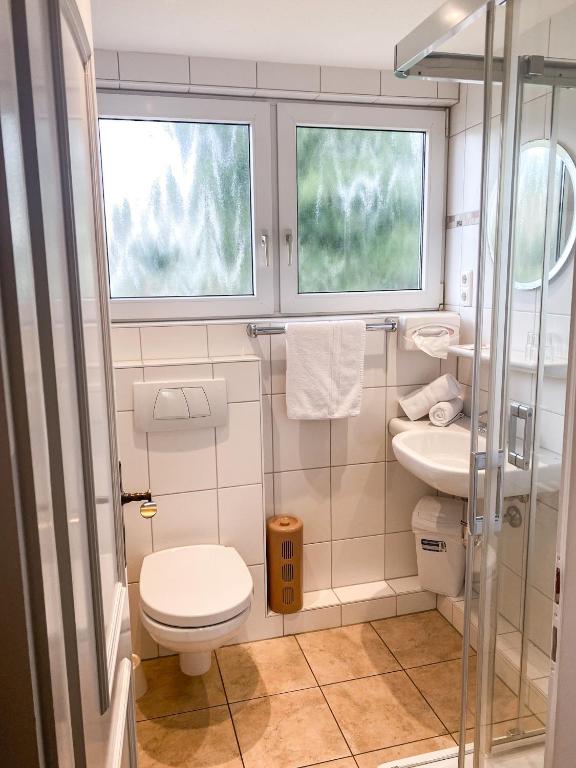Koupelna v ubytování Hotel Garni Silvana