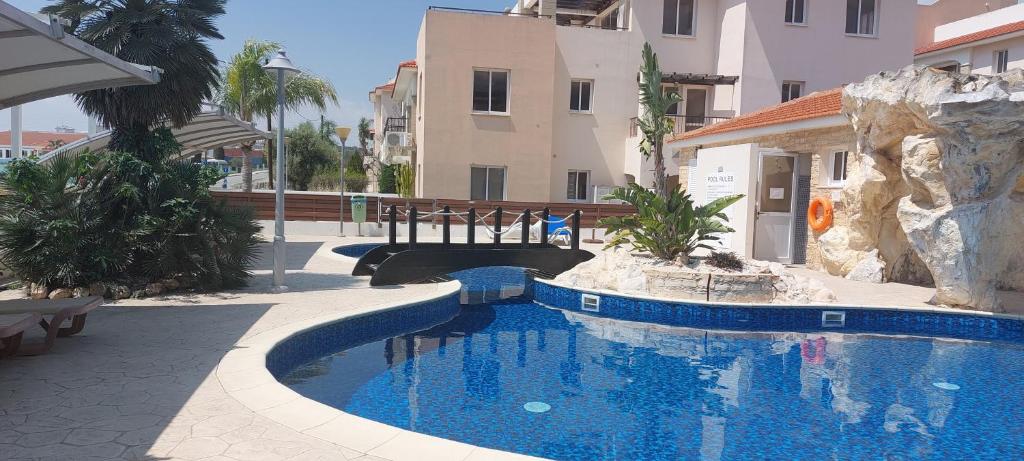 a swimming pool in the middle of a building at Pyla Palms A1 204 in Pyla