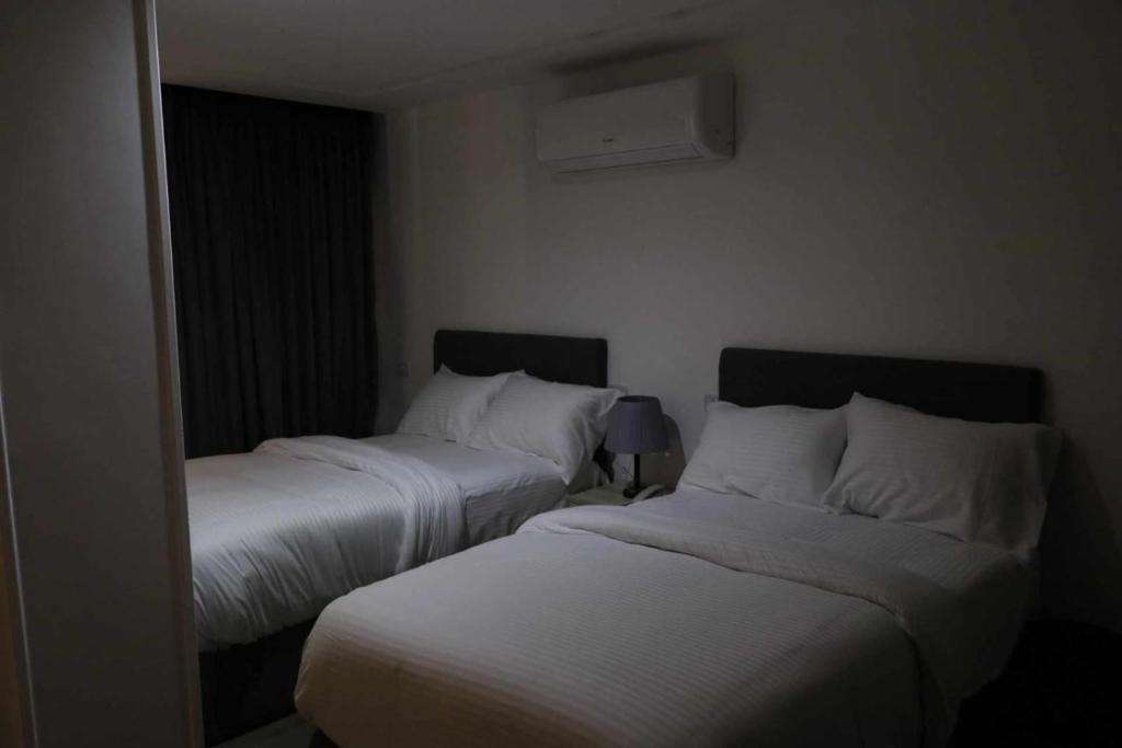 Postel nebo postele na pokoji v ubytování elhosary motel