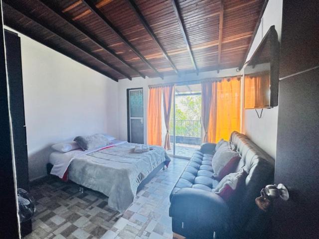 A bed or beds in a room at Casa Hotel Camino Real
