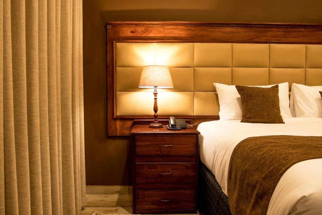 Voodi või voodid majutusasutuse Pemabwe Guest Lodge toas