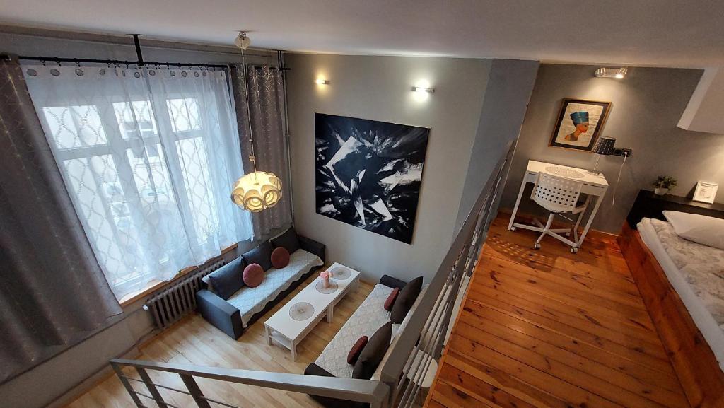 an aerial view of a living room with a couch at VIP Apartments - Apartamenty na Leszczyńskiego in Wrocław