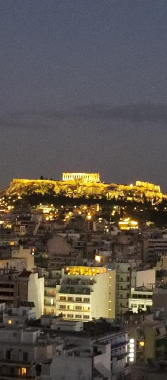 a view of a city at night with lights at Acropolis view and 360 degrees in Athens