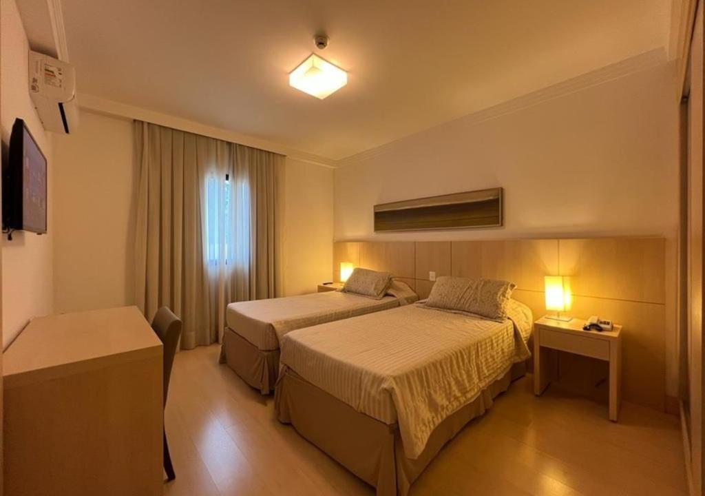Voodi või voodid majutusasutuse Apart-hotel Ribeirânia toas