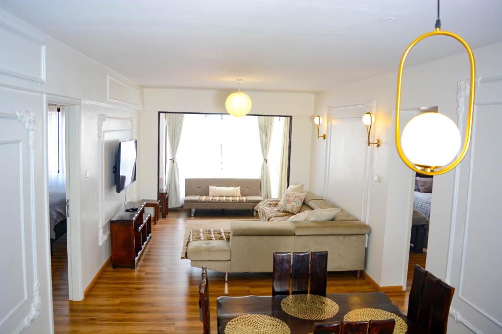 a living room with a couch and a table at Sonia Homes- Mi Vida in Nairobi