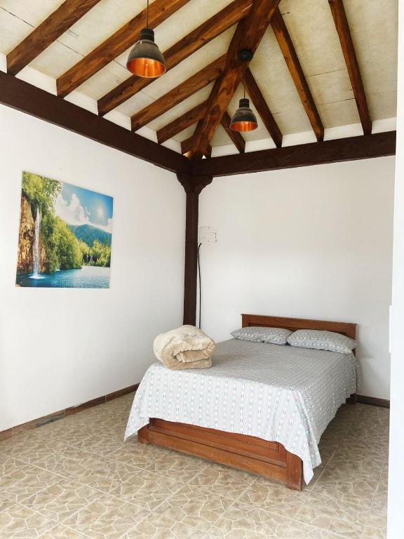 Postel nebo postele na pokoji v ubytování Hostal Inn II Rionegro
