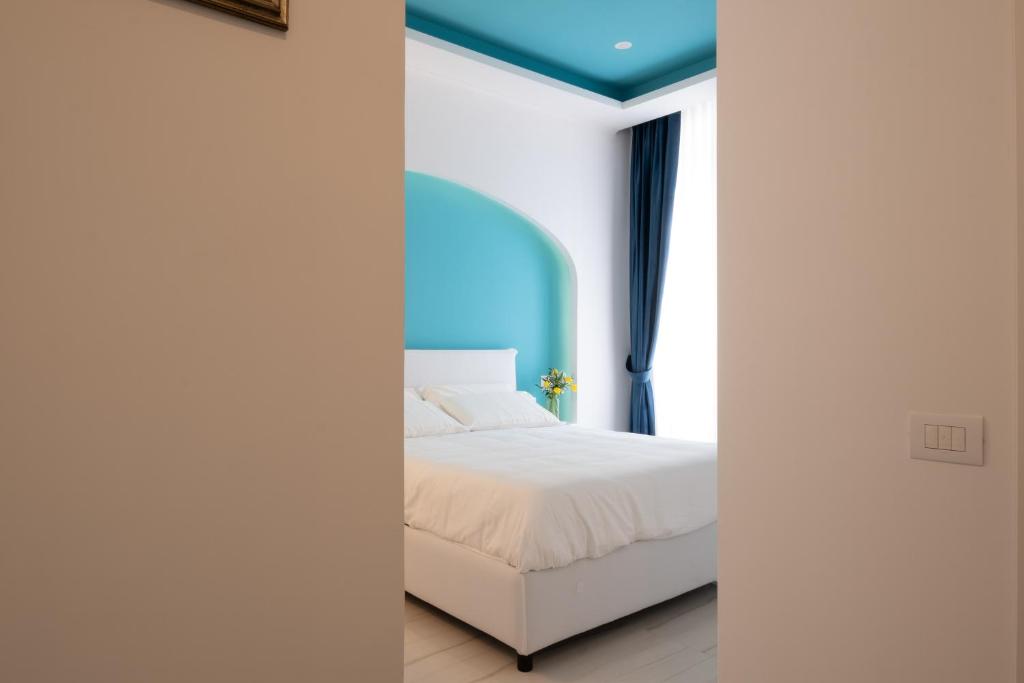Postel nebo postele na pokoji v ubytování Palazzo Adele Rooms & Apartments