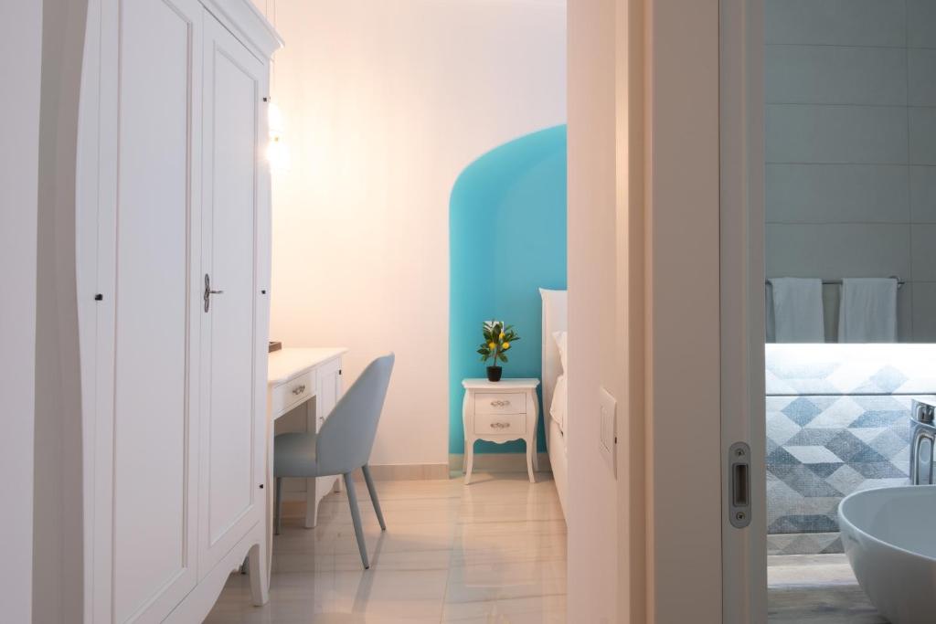 Postel nebo postele na pokoji v ubytování Palazzo Adele Rooms & Apartments