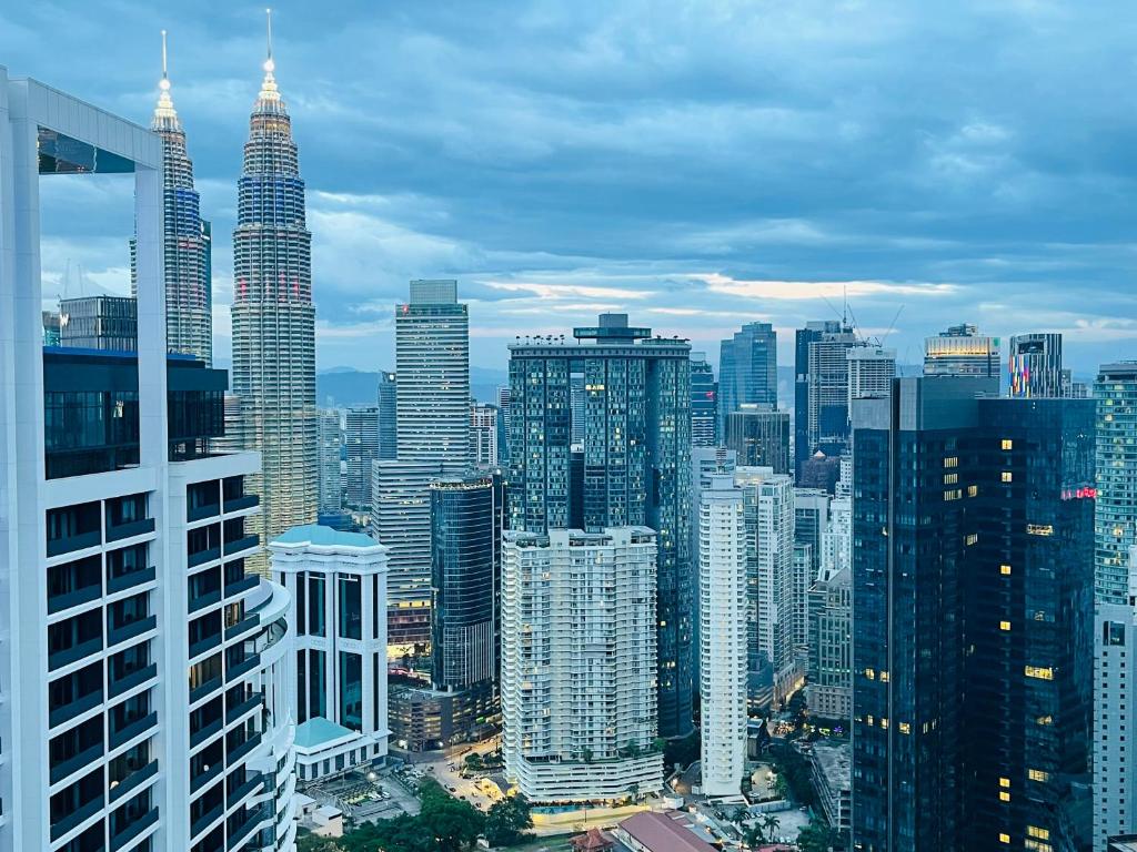 a view of a large city with tall buildings at The Platinum KLCC By Staycation in Kuala Lumpur