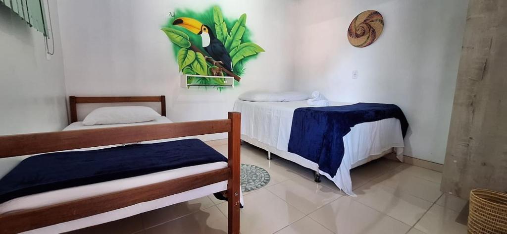 Una cama o camas en una habitación de Pousada Angatu alter