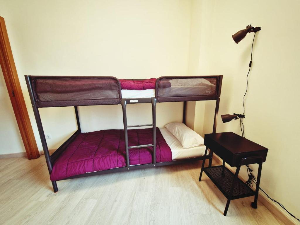 Postel nebo postele na pokoji v ubytování Albergue SIXTOs no Caminho