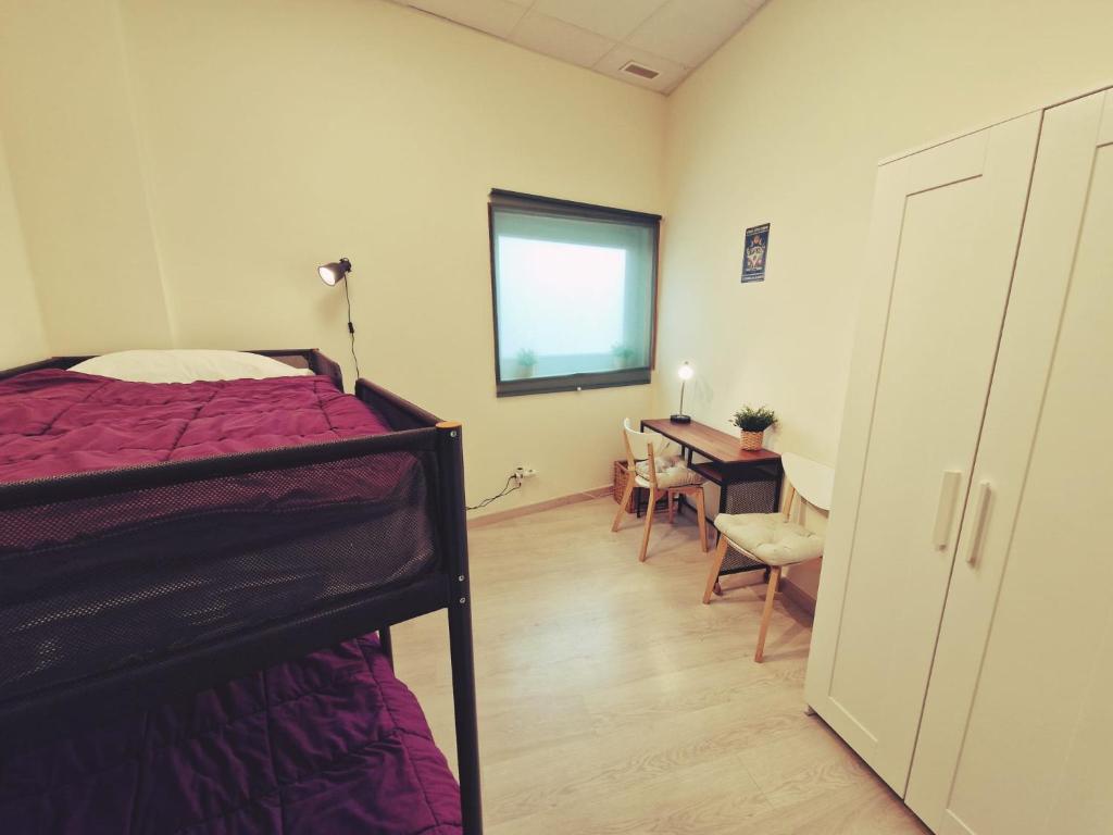 Postel nebo postele na pokoji v ubytování Albergue SIXTOs no Caminho