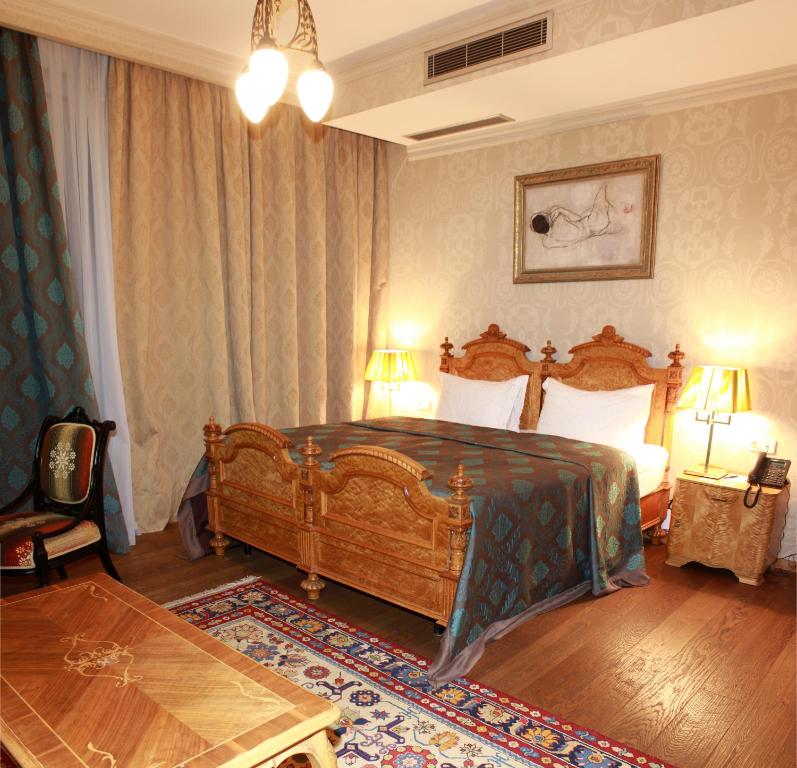 Postel nebo postele na pokoji v ubytování Vinotel Boutique Hotel