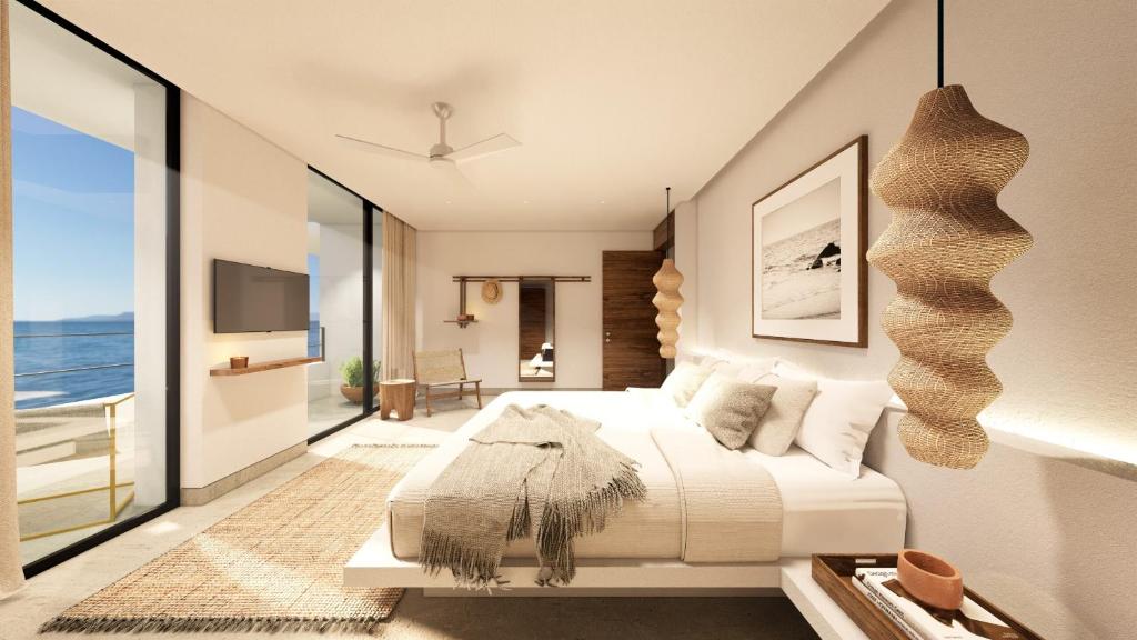 Postel nebo postele na pokoji v ubytování The Tryst Puerto Vallarta LGBT Hotel
