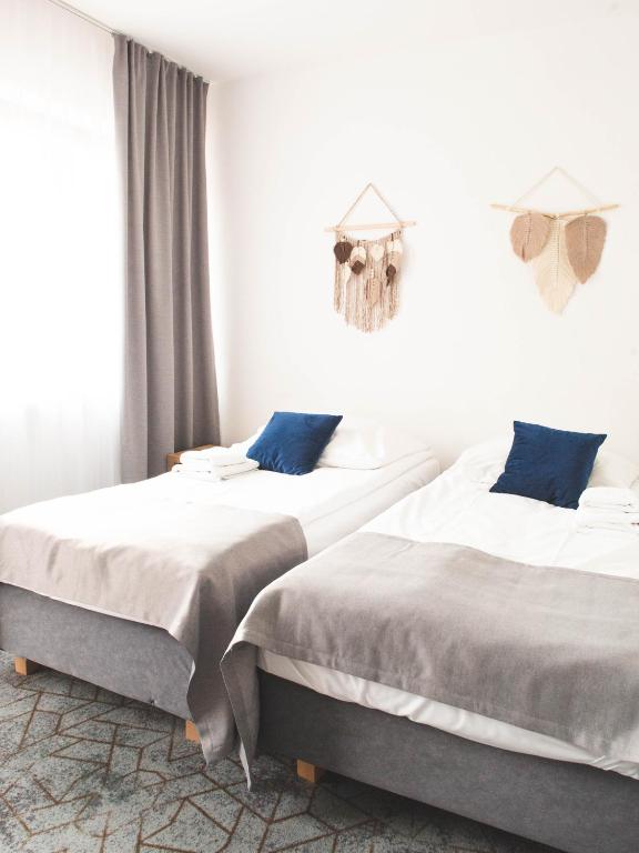 Postel nebo postele na pokoji v ubytování Hotel Beskidian