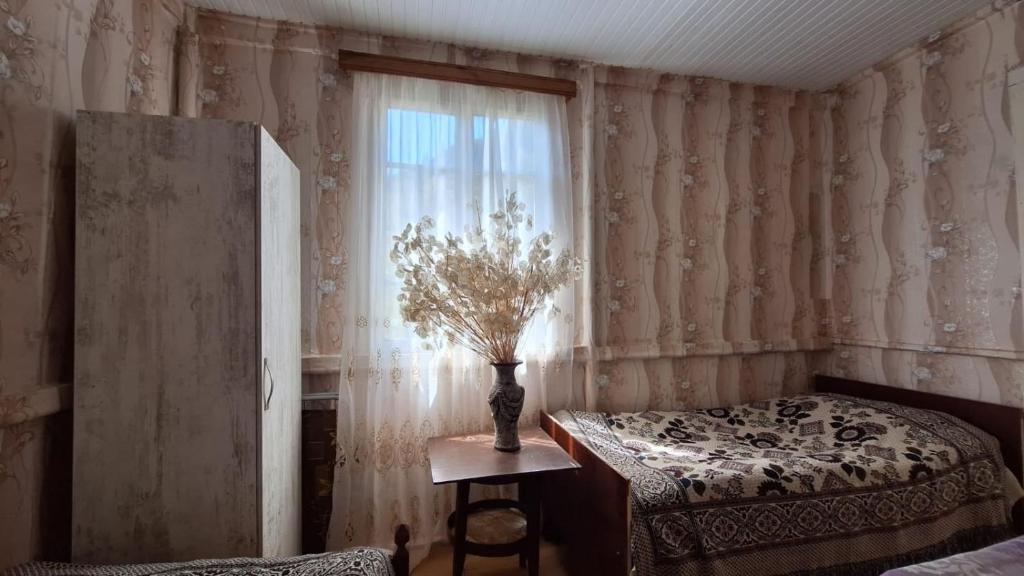 Postel nebo postele na pokoji v ubytování Guest House "SVANETI"
