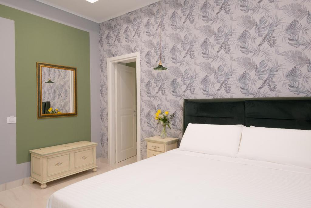 Postel nebo postele na pokoji v ubytování Palazzo Adele Rooms & Apartments