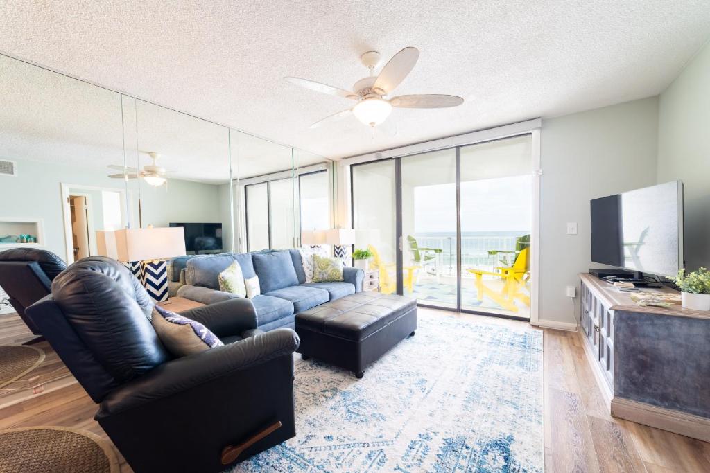 a living room with a couch and a tv at Seaside Beach Racquet 3504 in Orange Beach