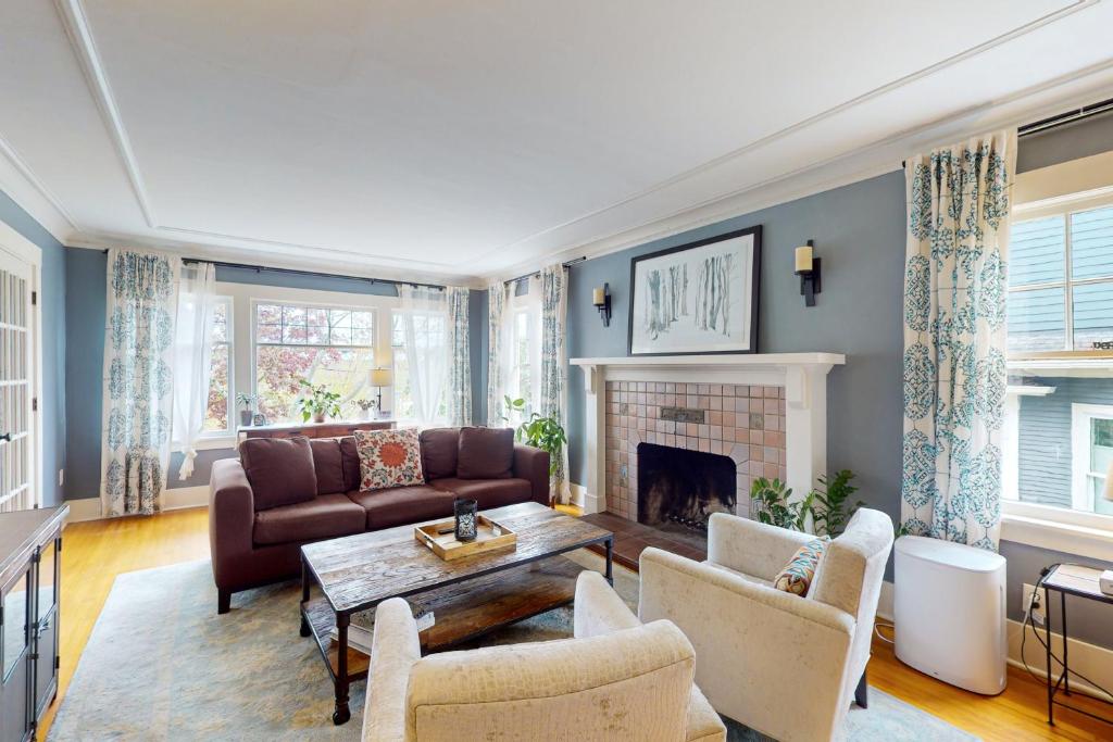 a living room with a couch and a fireplace at Harbor Haven in Seattle