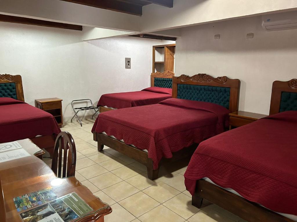Postel nebo postele na pokoji v ubytování Hotel Javy