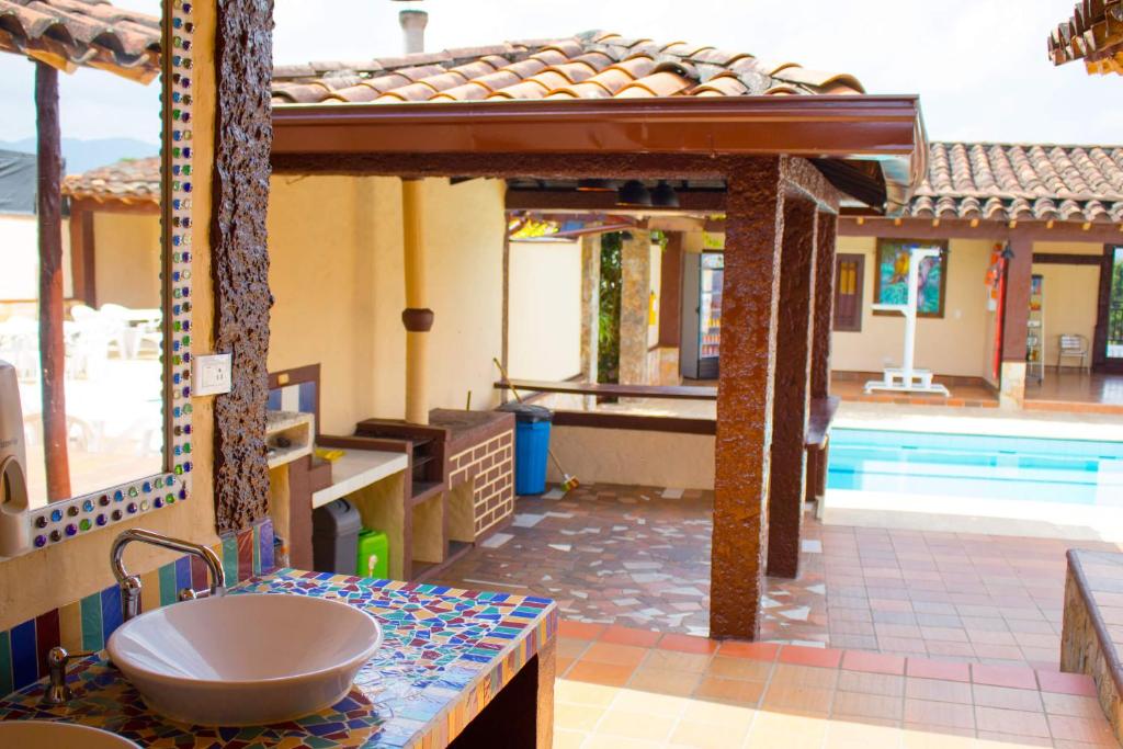 Bazén v ubytování Hostal Inn II Rionegro nebo v jeho okolí