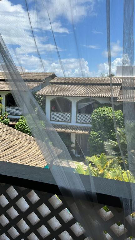 a view of a house from a window at Flor da Mata in Pipa