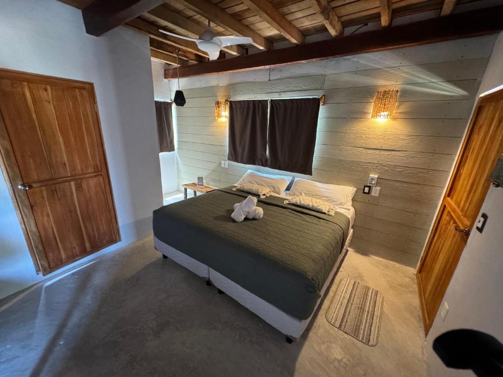 Postel nebo postele na pokoji v ubytování MARIBY HOLBOX