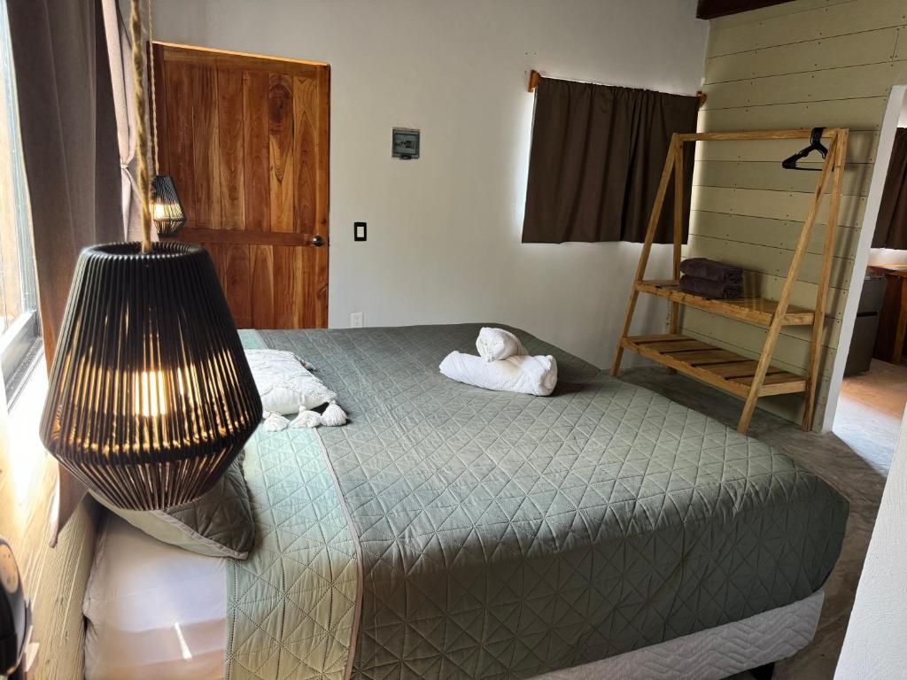 Postel nebo postele na pokoji v ubytování MARIBY HOLBOX
