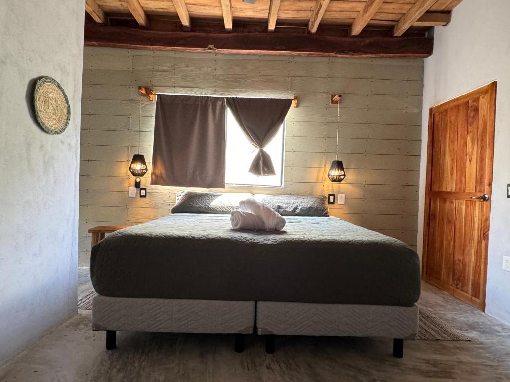 Postel nebo postele na pokoji v ubytování MARIBY HOLBOX