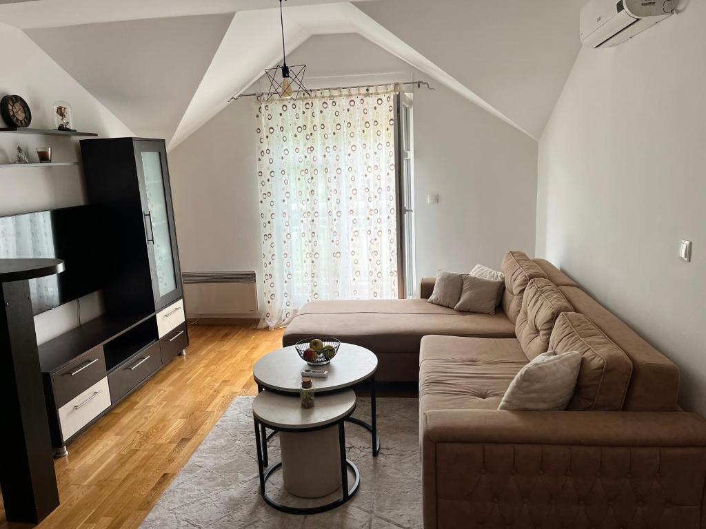 a living room with a couch and a table at Apartman Mak in Mostar