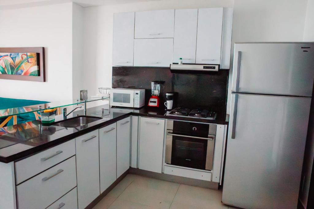 Kuchyň nebo kuchyňský kout v ubytování Playa Cartagena Apartments