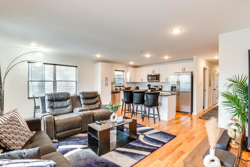 a living room with a couch and a table at Modern Elizabeth Apartment about 1 Mi to Train Station in Elizabeth
