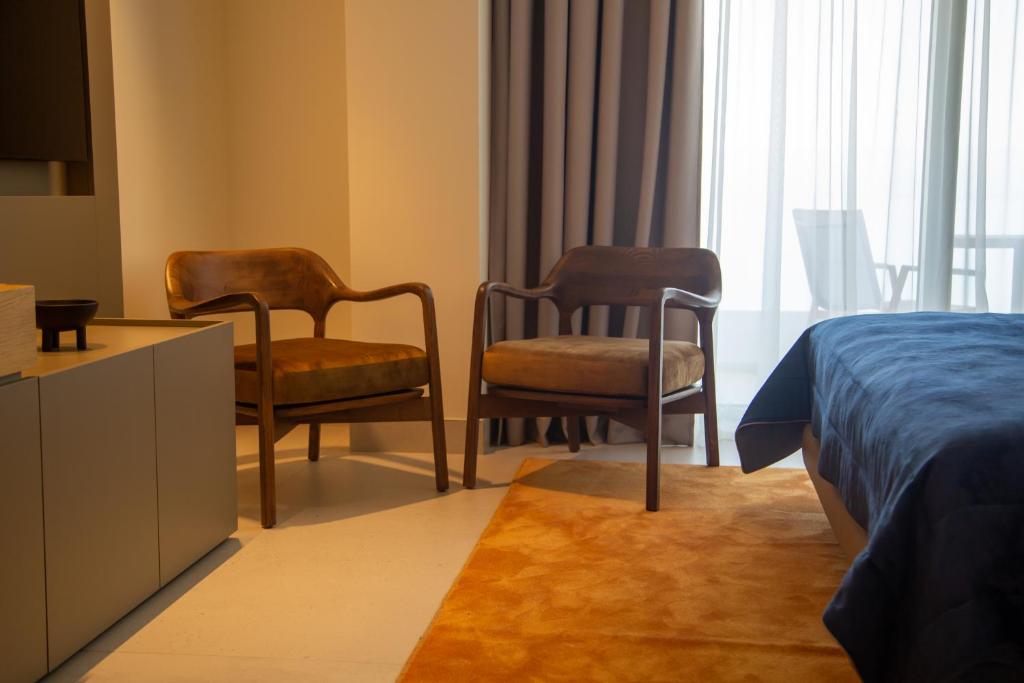 Postel nebo postele na pokoji v ubytování Abi's Hotel & SPA Vlore