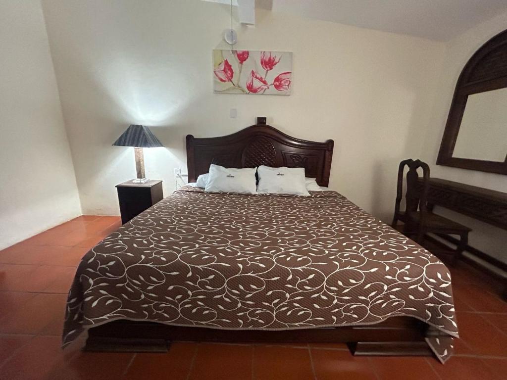 Giường trong phòng chung tại HOTEL VILLAS MARIAS