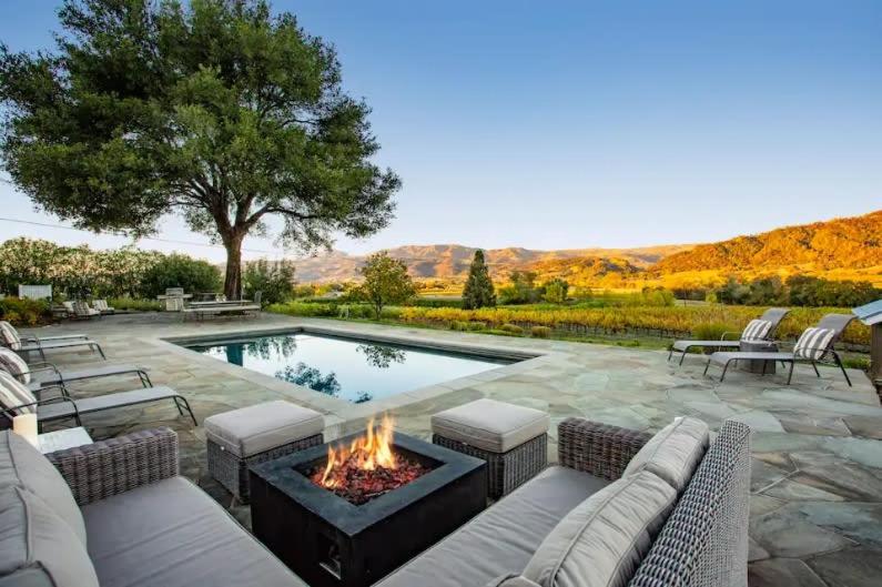 a backyard with a fire pit and a swimming pool at Exclusive Wine Country Estate - The Haven in Healdsburg