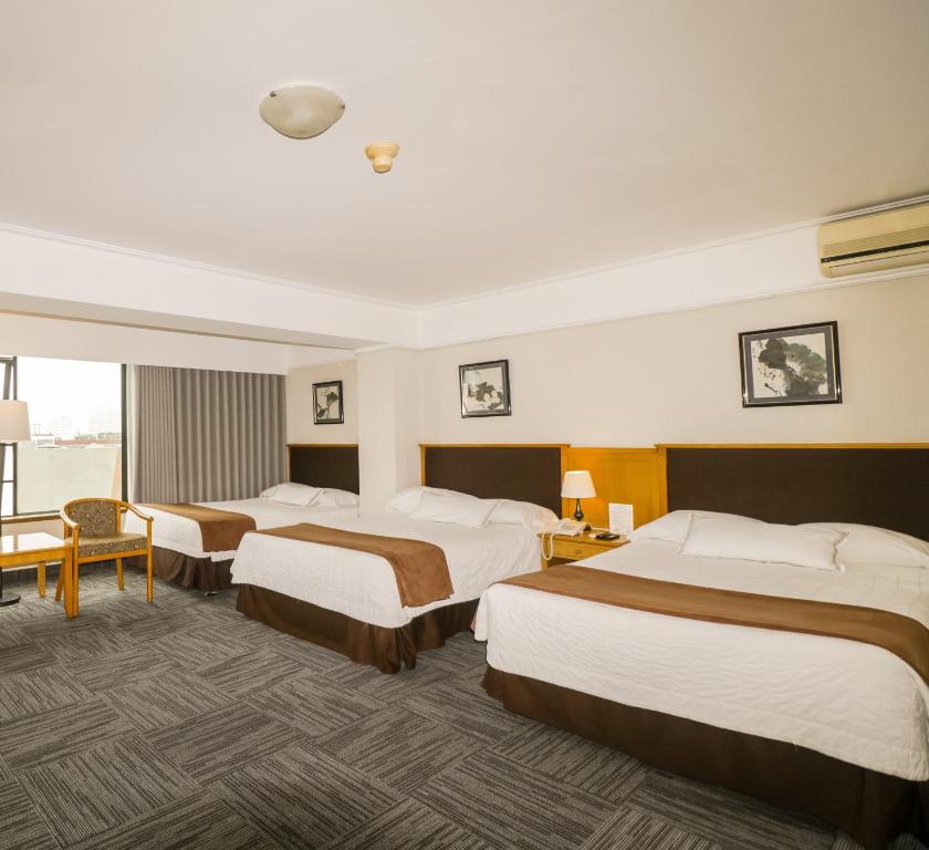 Postel nebo postele na pokoji v ubytování Hotel Miramar
