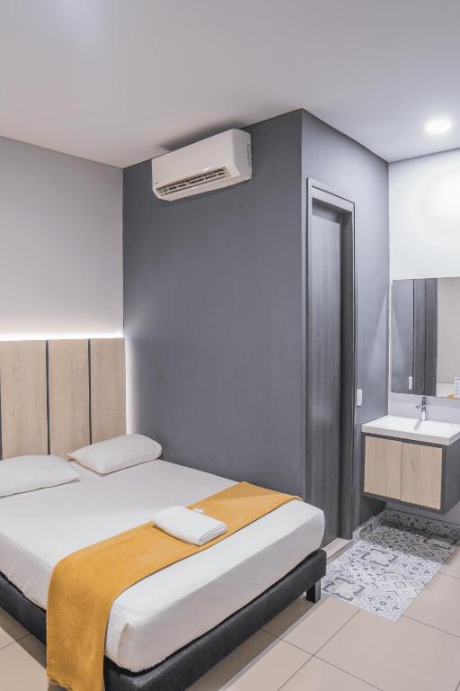 Letto o letti in una camera di HOTEL NABU VALLEDUPAR