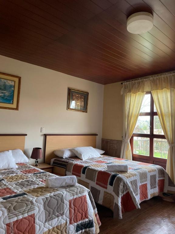 Postel nebo postele na pokoji v ubytování Minkana Hotel